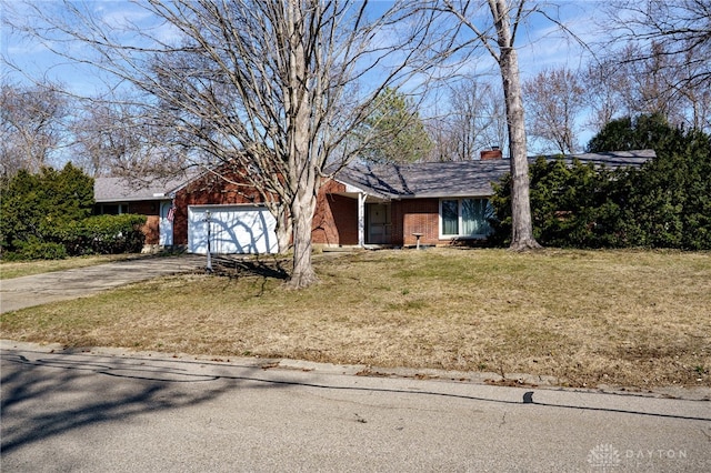 single story home with a front lawn, driveway, a garage, brick siding, and a chimney