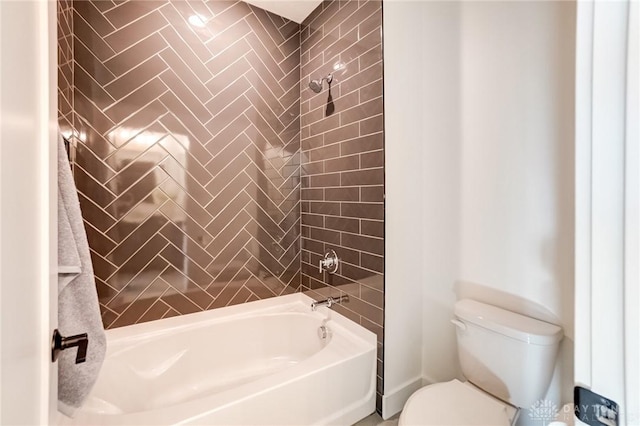 bathroom with toilet and bathtub / shower combination