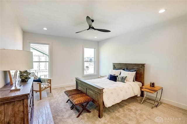 bedroom with light carpet, recessed lighting, baseboards, and ceiling fan