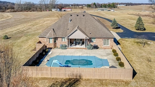 view of pool with a patio area, a fenced in pool, a yard, and a fenced backyard