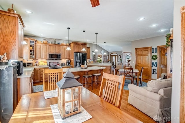 dining area featuring recessed lighting and light wood-style flooring