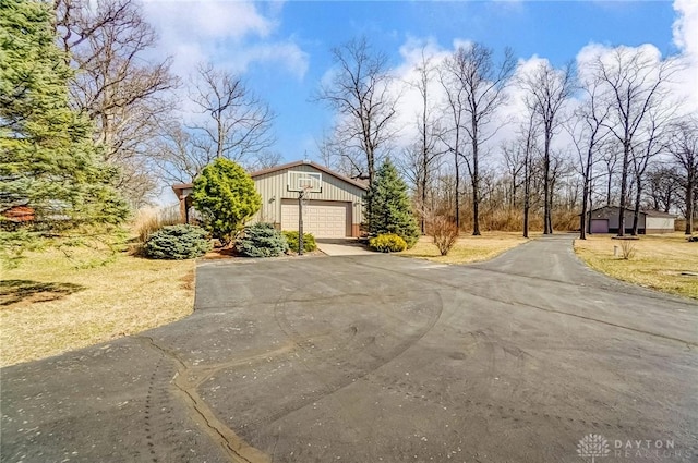 view of front of home with an outdoor structure and a garage