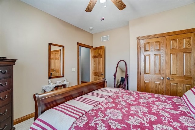 bedroom with visible vents, baseboards, and ceiling fan