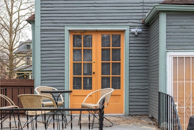 exterior space featuring a patio area, french doors, and fence