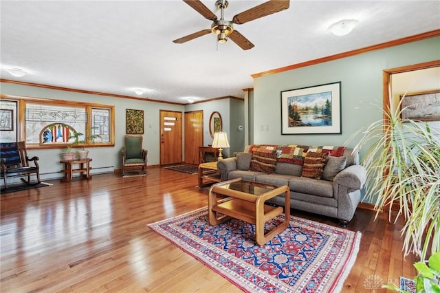 living area with ceiling fan, baseboards, wood-type flooring, and ornamental molding