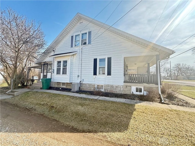 view of property exterior with a porch and central AC unit