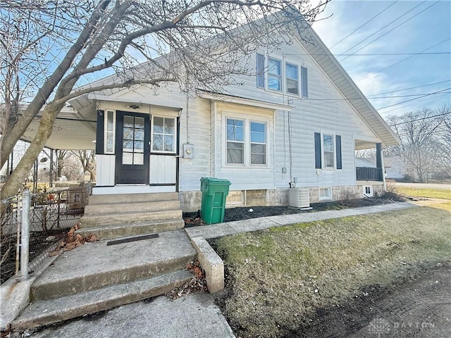 bungalow featuring covered porch and central AC