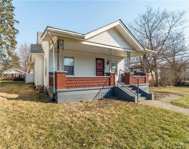 view of front of property featuring a porch and a front lawn