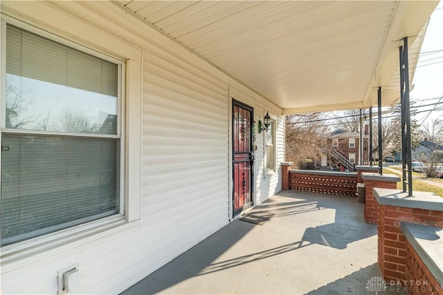 view of patio featuring a porch