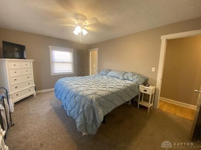 bedroom with carpet flooring, ceiling fan, and baseboards