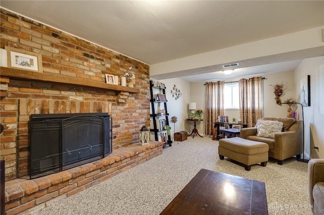 living area with a brick fireplace, visible vents, and carpet floors