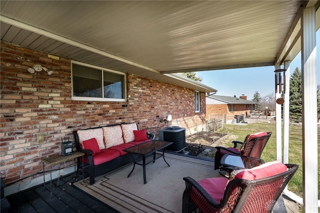 view of patio / terrace with central air condition unit, fence, and an outdoor hangout area