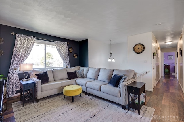 living room featuring baseboards and wood finished floors