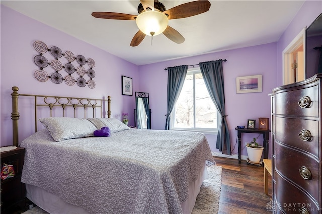 bedroom featuring dark wood finished floors and ceiling fan