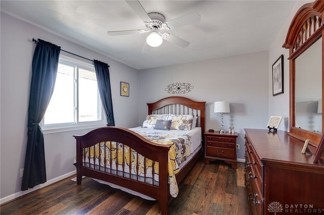 bedroom with dark wood finished floors, ceiling fan, and baseboards