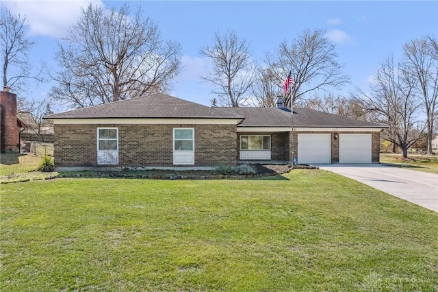 ranch-style home with a front yard, concrete driveway, brick siding, and a garage