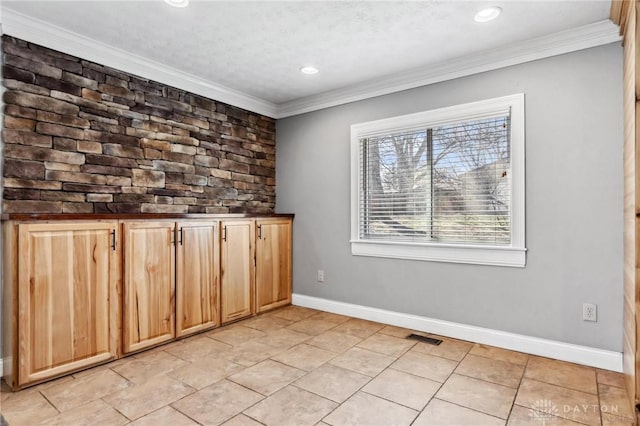 interior space featuring recessed lighting, visible vents, baseboards, and ornamental molding