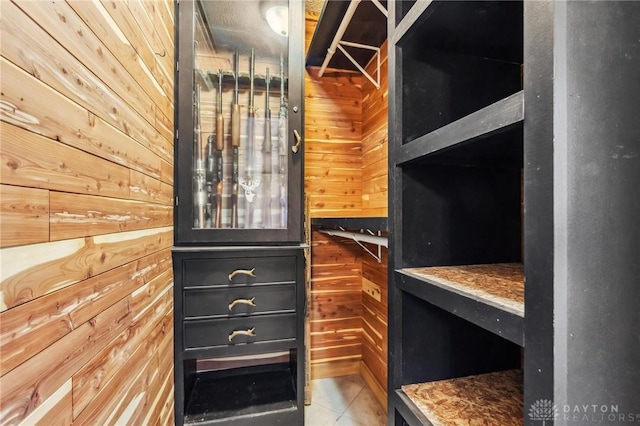 spacious closet featuring tile patterned flooring