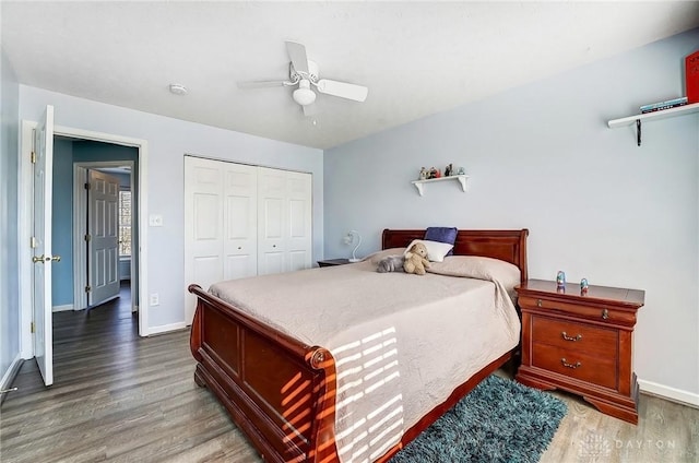 bedroom with a closet, ceiling fan, baseboards, and wood finished floors