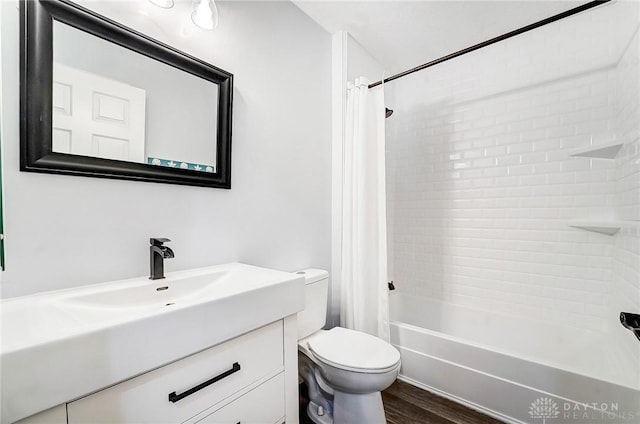 full bath featuring wood finished floors, toilet, vanity, and shower / bathtub combination with curtain