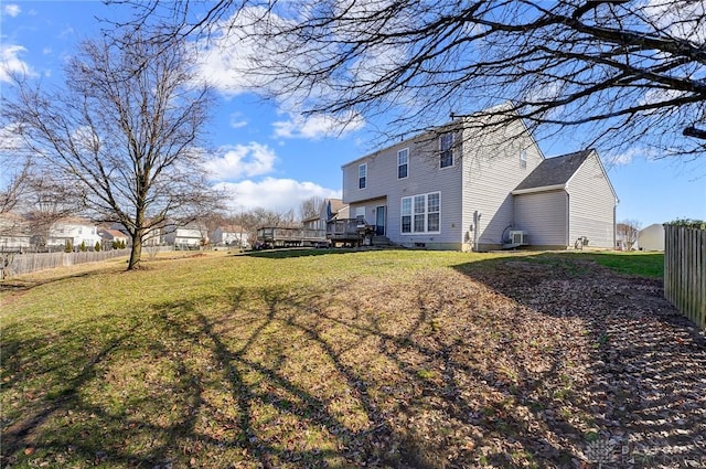 view of yard featuring a deck and fence