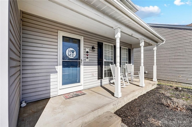 entrance to property featuring a porch