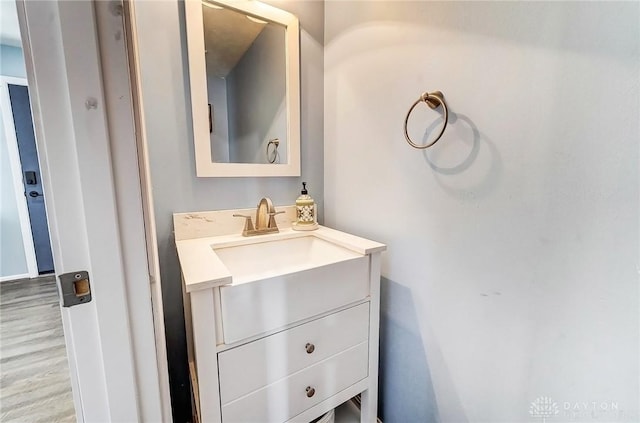 bathroom featuring vanity and wood finished floors