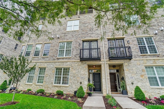 view of front of property featuring brick siding