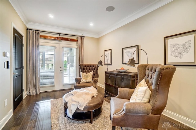 sitting room featuring wood finished floors, french doors, baseboards, and ornamental molding