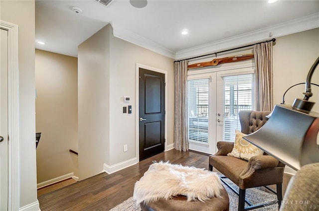 living area with baseboards, dark wood-type flooring, french doors, crown molding, and an upstairs landing