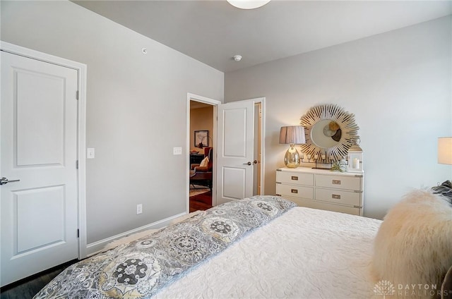 bedroom featuring baseboards