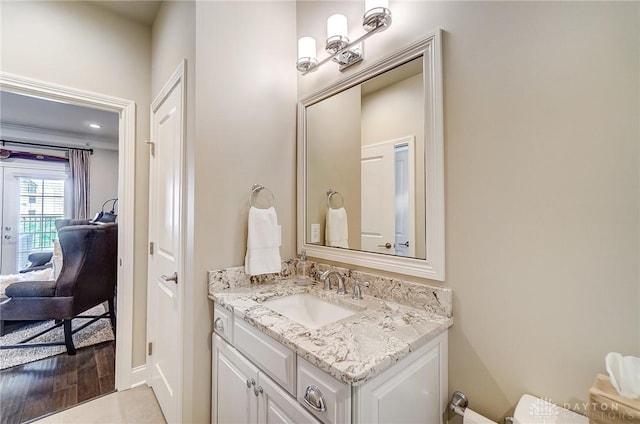 bathroom with vanity and wood finished floors