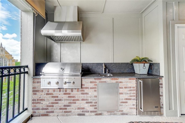 view of patio / terrace featuring exterior kitchen, area for grilling, and a sink