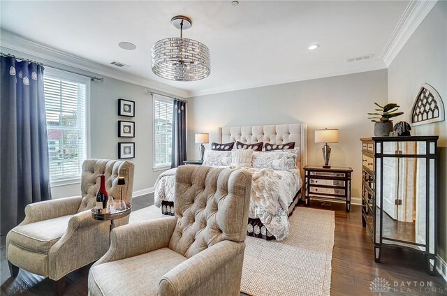 bedroom featuring visible vents, dark wood-style flooring, and ornamental molding