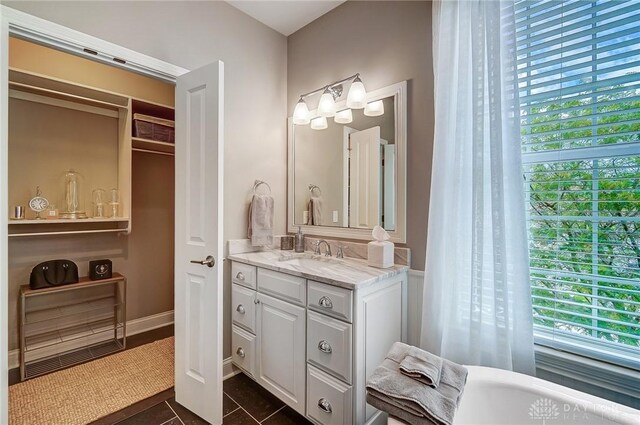 bathroom featuring tile patterned floors, plenty of natural light, and vanity