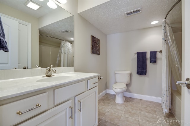 full bathroom featuring tile patterned floors, visible vents, and a textured ceiling