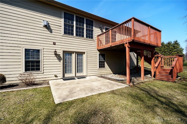 back of house with a deck, a lawn, stairs, and a patio