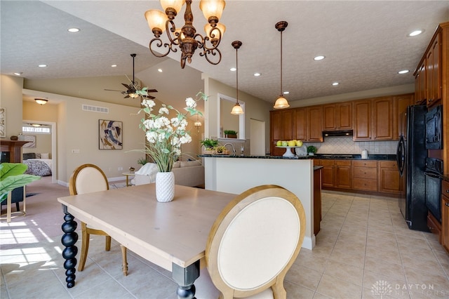 dining area featuring visible vents, a textured ceiling, recessed lighting, light tile patterned floors, and vaulted ceiling