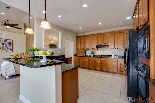 kitchen with black appliances, light tile patterned floors, dark stone countertops, brown cabinetry, and a textured ceiling