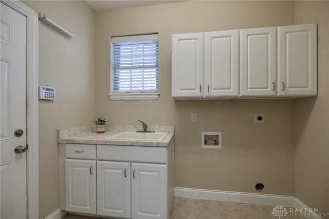 laundry area featuring electric dryer hookup, a sink, cabinet space, baseboards, and hookup for a washing machine