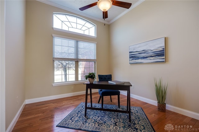 office featuring hardwood / wood-style floors, baseboards, and ornamental molding