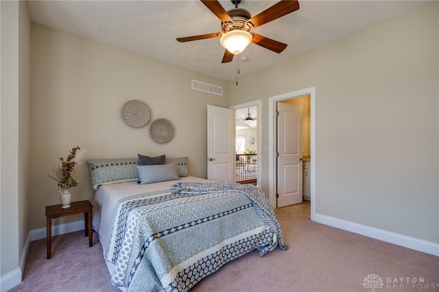 bedroom with a ceiling fan, visible vents, baseboards, a textured ceiling, and light colored carpet