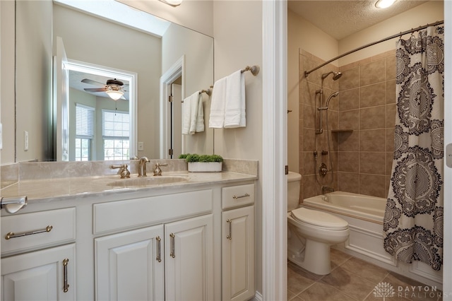 full bath featuring tile patterned flooring, ceiling fan, toilet, shower / bath combination with curtain, and vanity