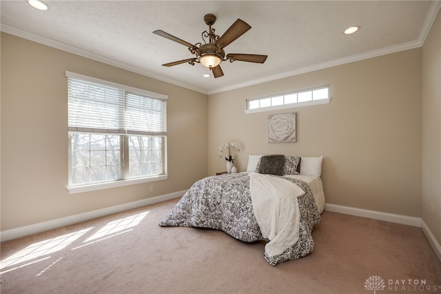 carpeted bedroom with recessed lighting, multiple windows, baseboards, and ornamental molding