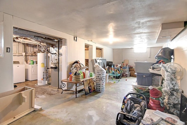 below grade area featuring gas water heater and washing machine and clothes dryer