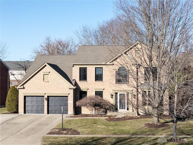 view of front facade with stucco siding, a front yard, driveway, and a shingled roof