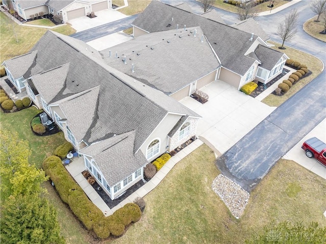 birds eye view of property with a residential view