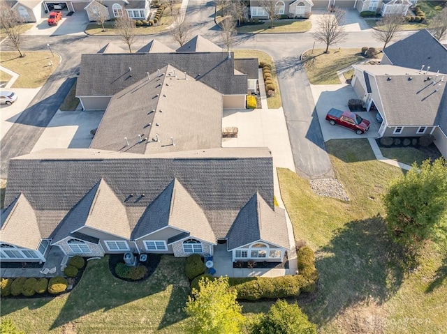 birds eye view of property with a residential view