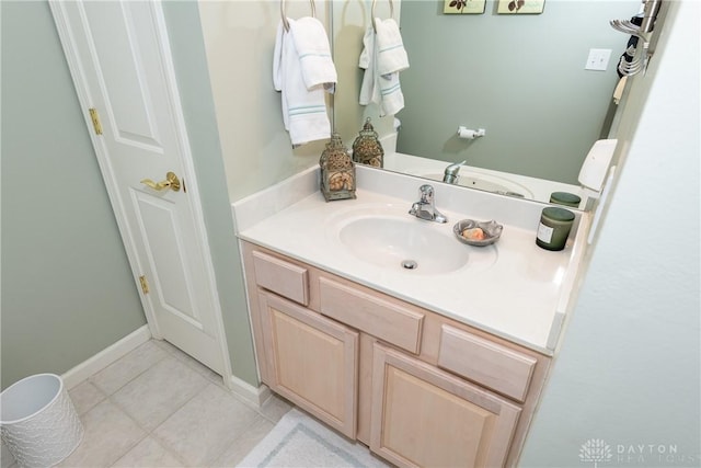 bathroom featuring vanity, tile patterned floors, and baseboards