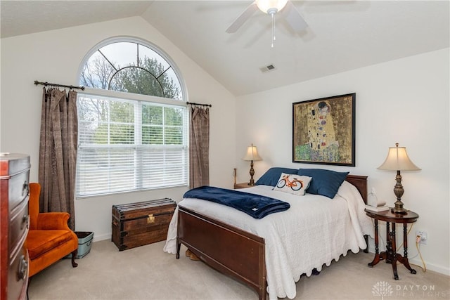 bedroom featuring lofted ceiling, visible vents, carpet floors, and ceiling fan